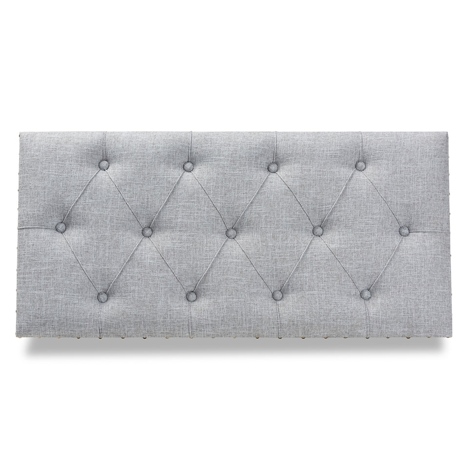 Kyra grey fabric upholstered storage trunk ottoman.