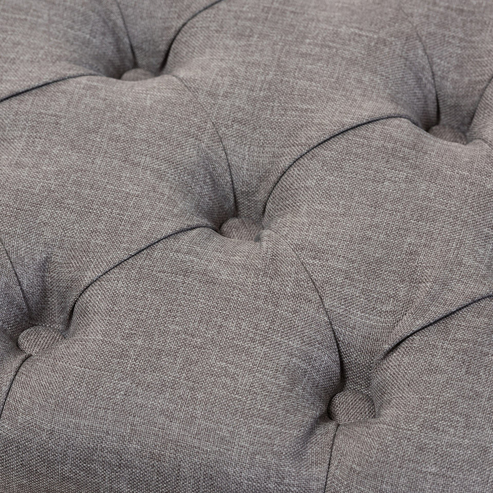 Annabelle modern button-tufted storage ottoman.