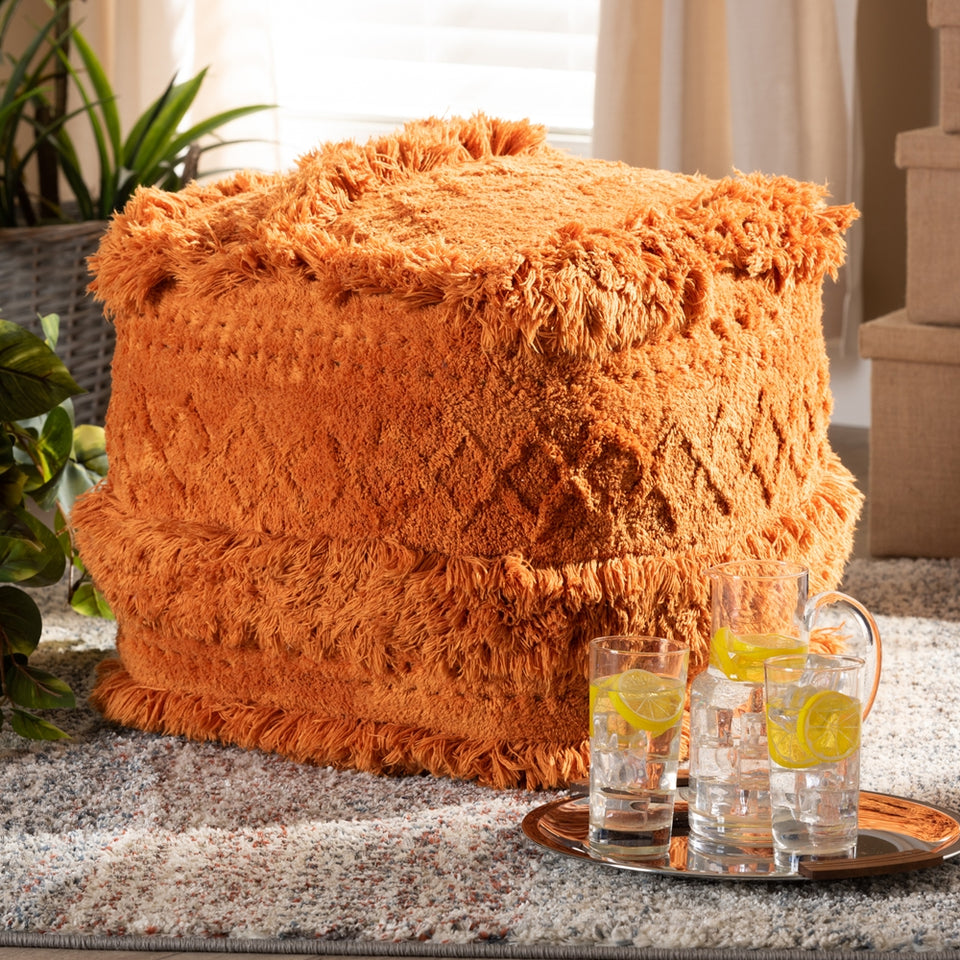 Curlew Moroccan inspired orange handwoven cotton pouf ottoman.