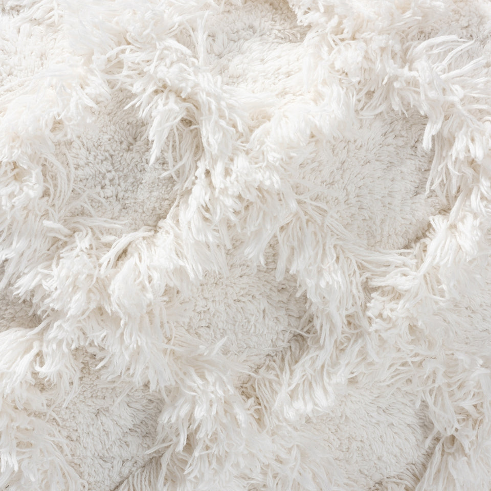 Asuka Moroccan inspired Ivory handwoven cotton fringe pouf ottoman.