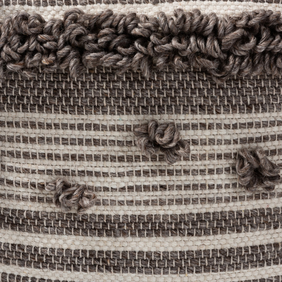 Eligah Moroccan inspired ivory and brown handwoven wool pouf ottoman.