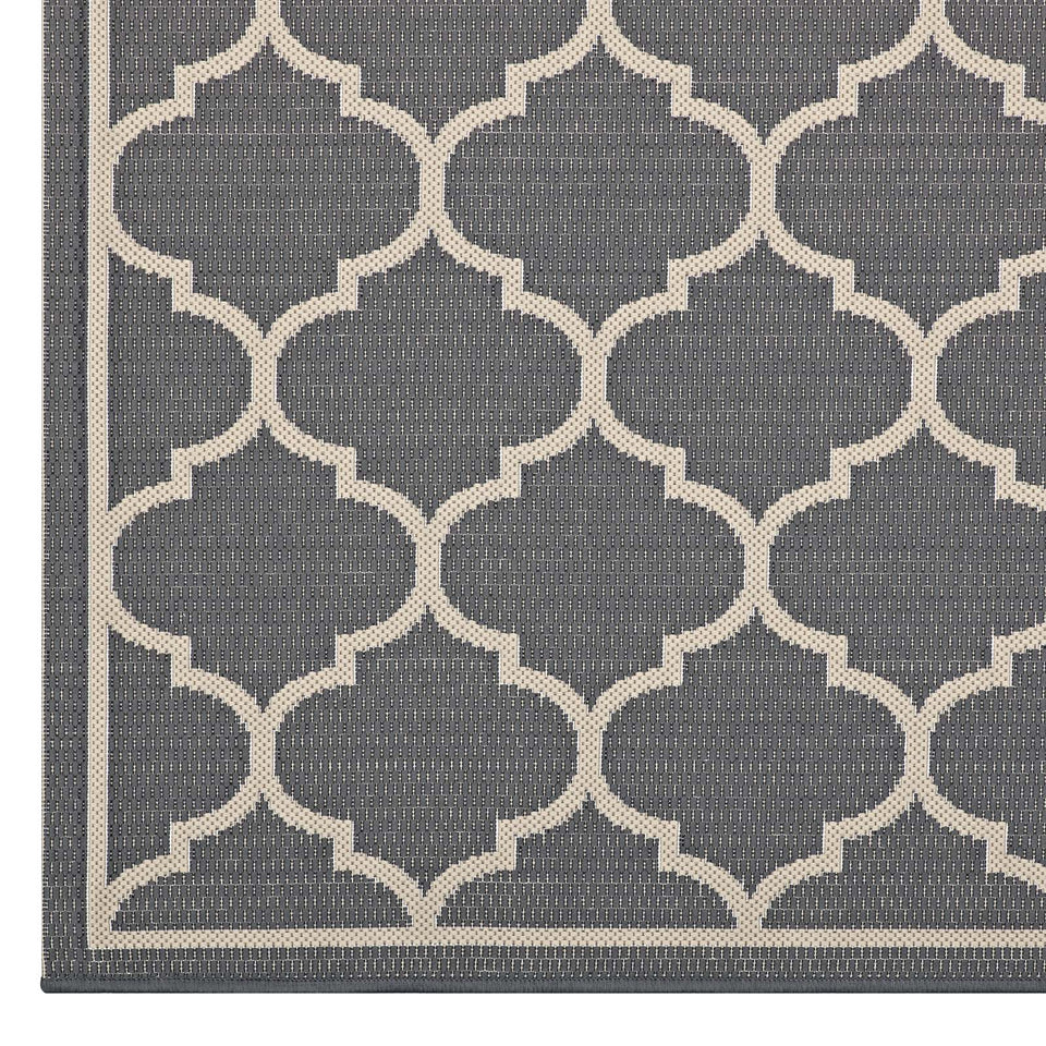 Avena Moroccan Quatrefoil Trellis Indoor and Outdoor Area Rug in Gray and Beige.