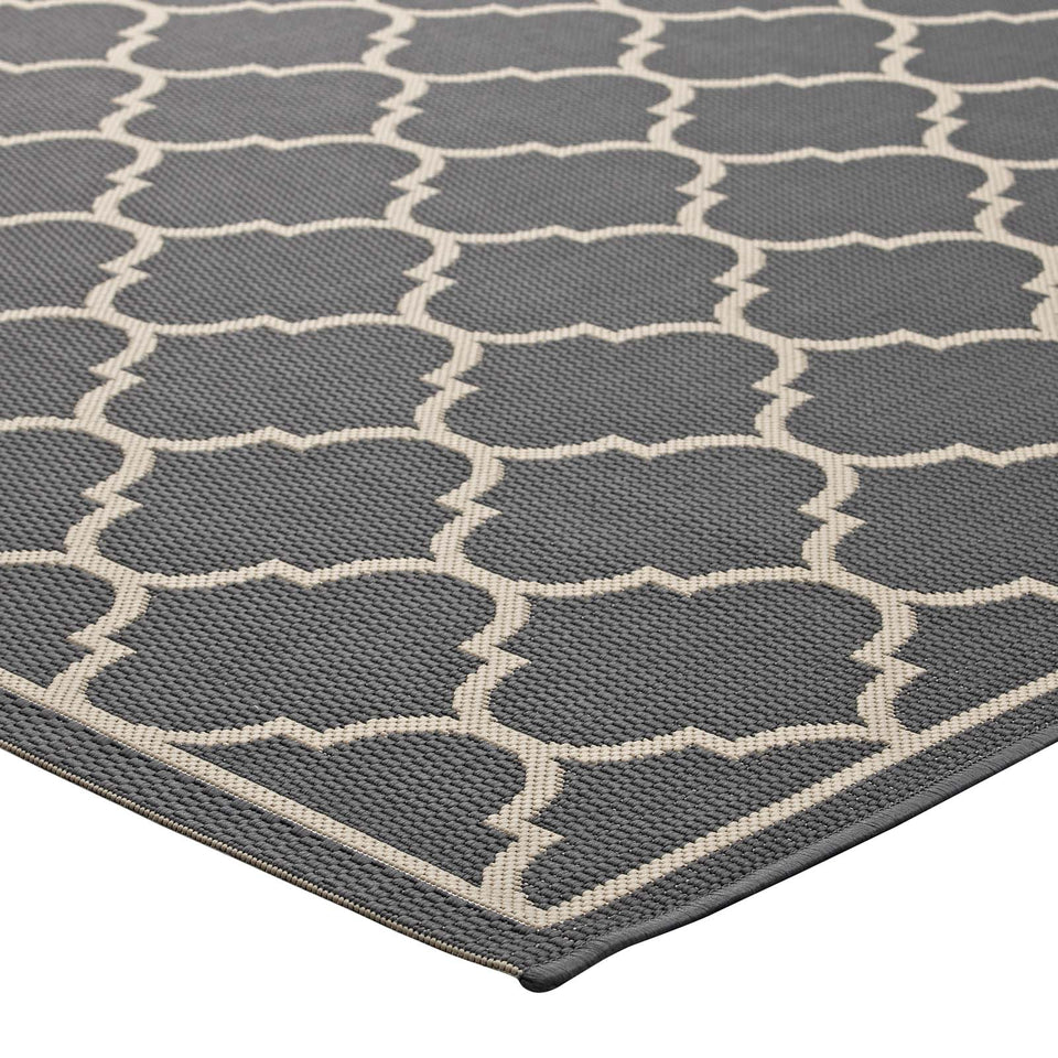 Avena Moroccan Quatrefoil Trellis Indoor and Outdoor Area Rug in Gray and Beige.