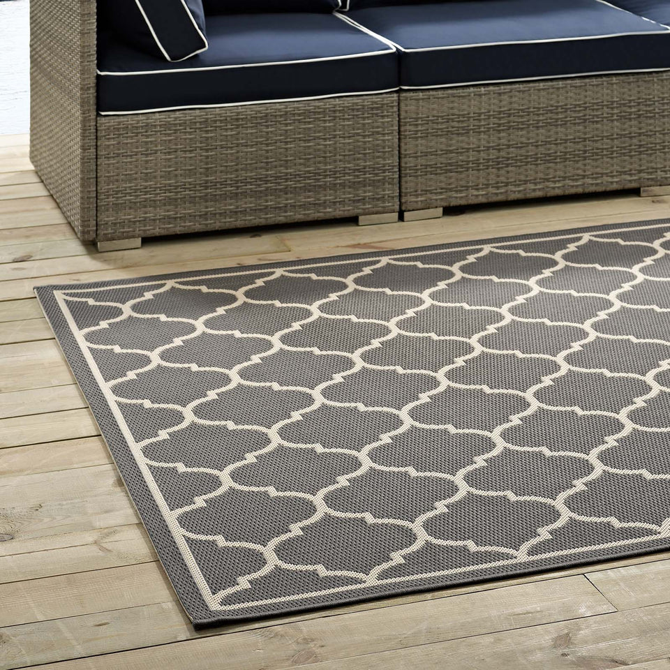 Avena Moroccan Quatrefoil Trellis Indoor and Outdoor Area Rug in Gray and Beige.