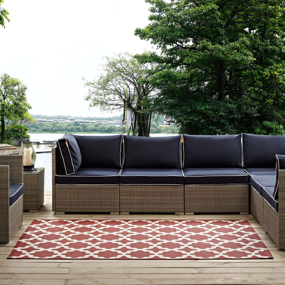 Cerelia Moroccan Trellis Indoor and Outdoor Area Rug in Red and Beige.