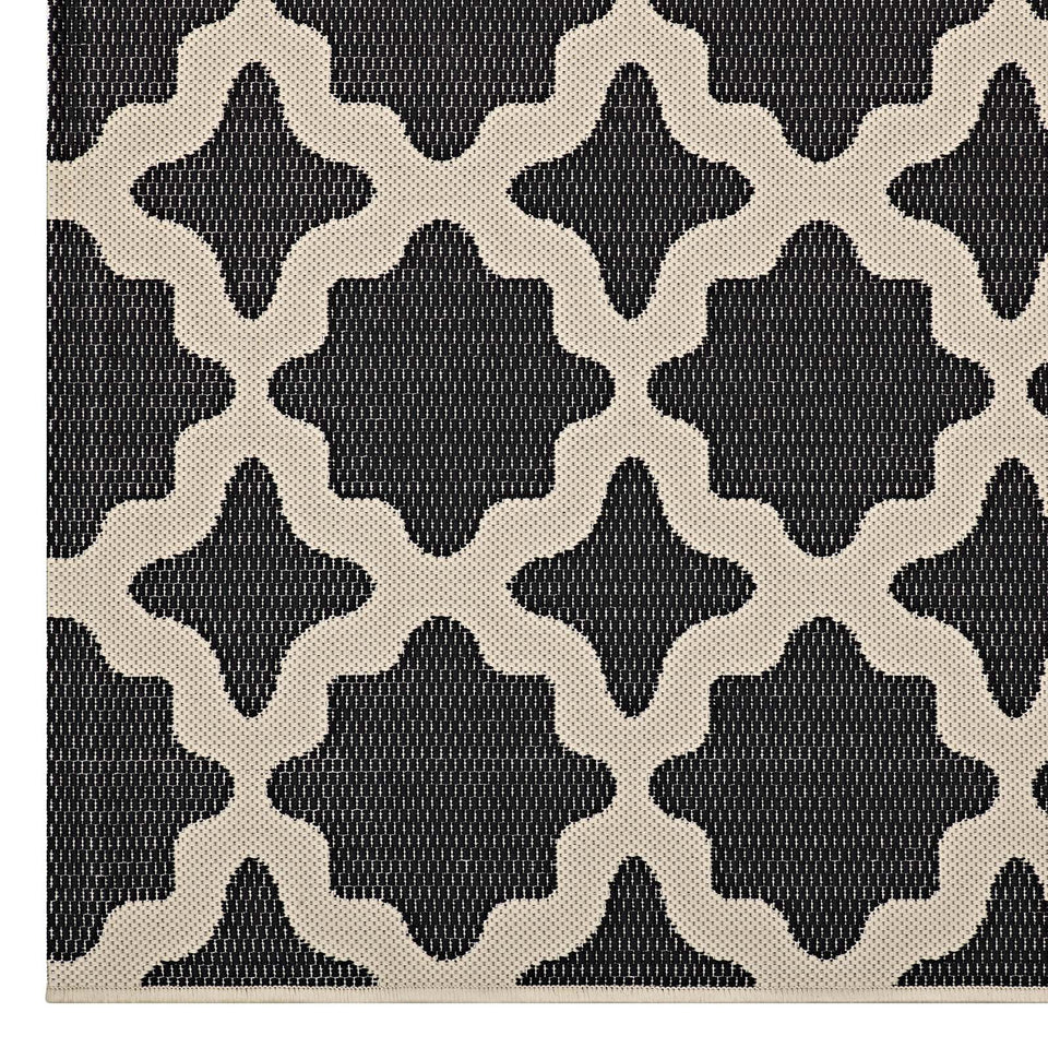 Cerelia Moroccan Trellis Indoor and Outdoor Area Rug in Black and Beige.