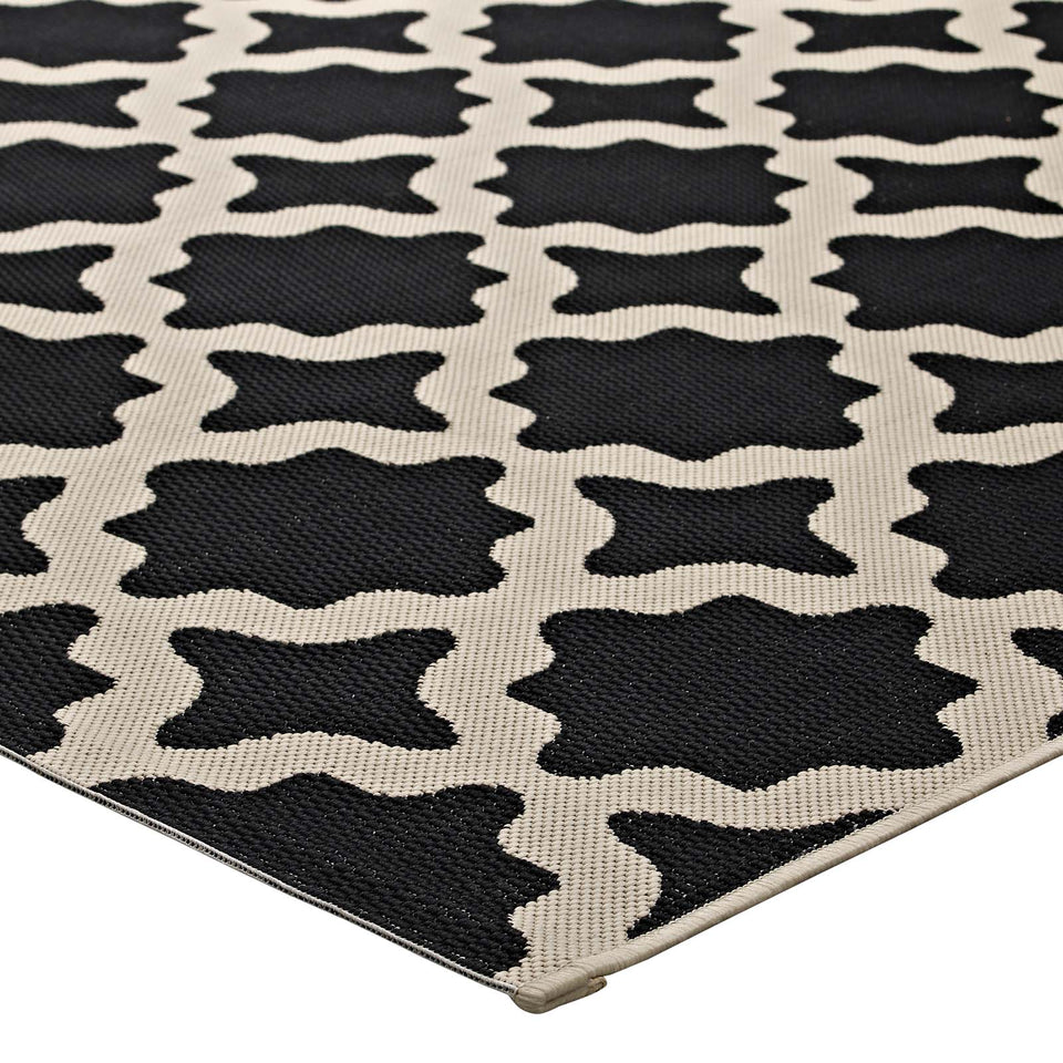 Cerelia Moroccan Trellis Indoor and Outdoor Area Rug in Black and Beige.