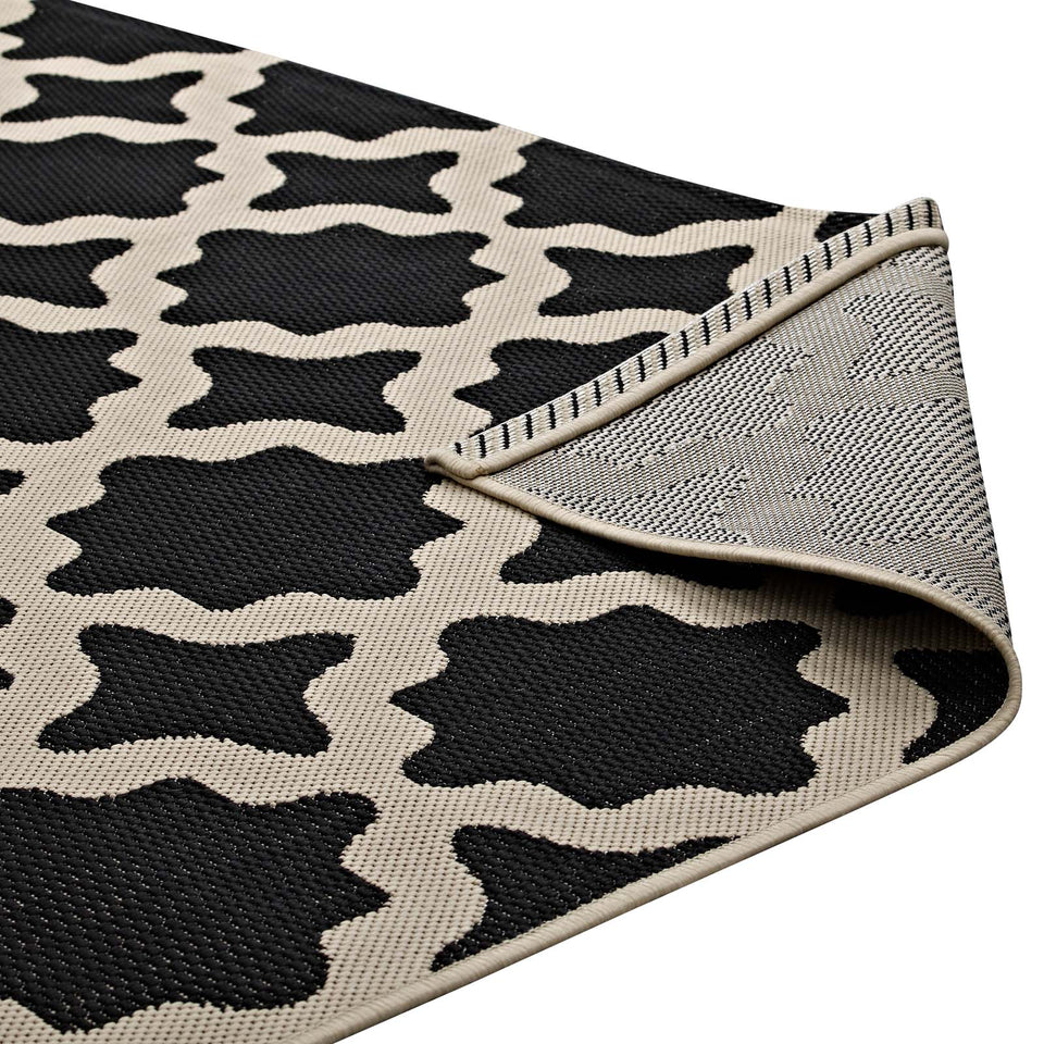 Cerelia Moroccan Trellis Indoor and Outdoor Area Rug in Black and Beige.