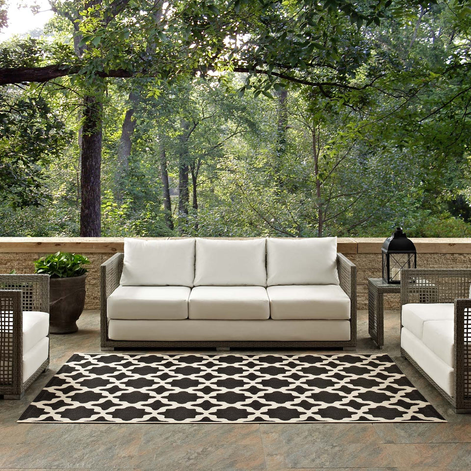Cerelia Moroccan Trellis Indoor and Outdoor Area Rug in Black and Beige.