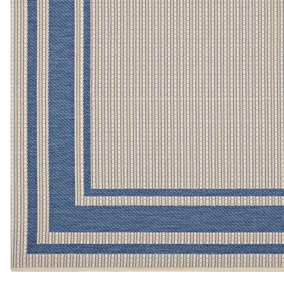 Rim Solid Border Indoor and Outdoor Area Rug in Blue and Beige.