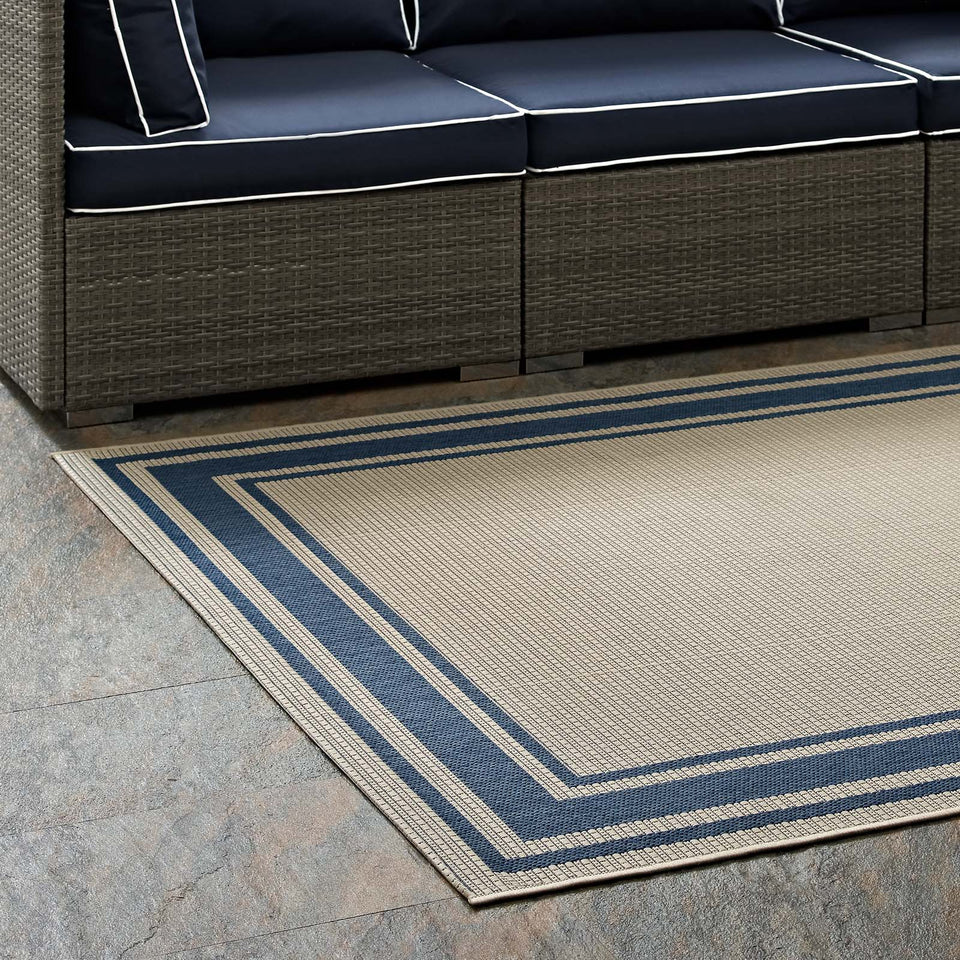Rim Solid Border Indoor and Outdoor Area Rug in Blue and Beige.