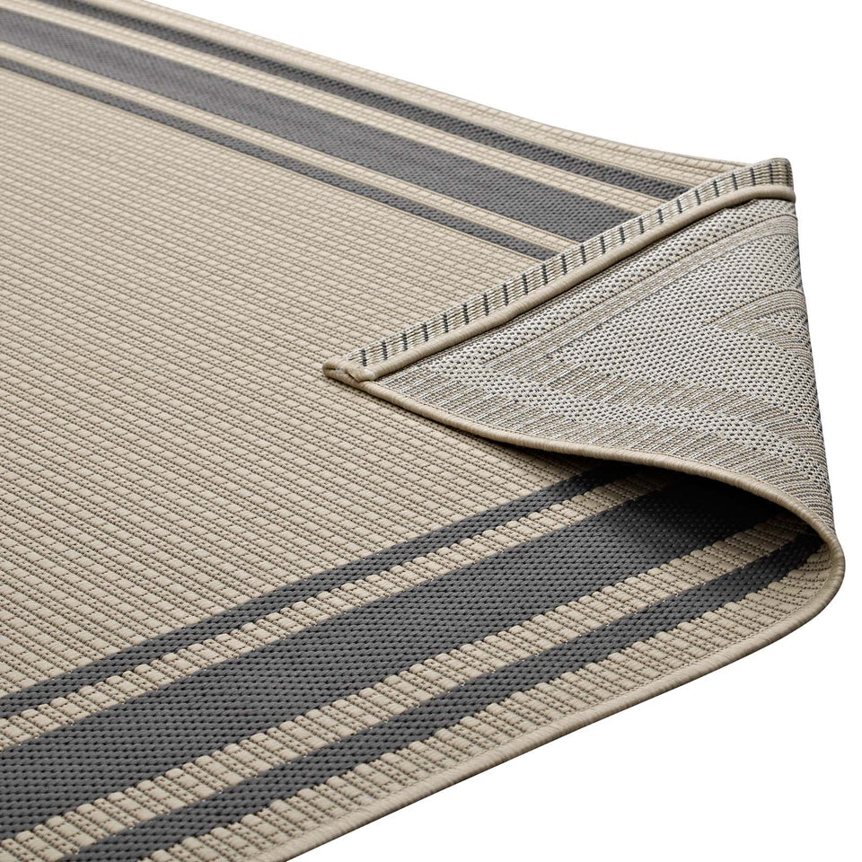Rim Solid Border Indoor and Outdoor Area Rug in Gray and Beige.
