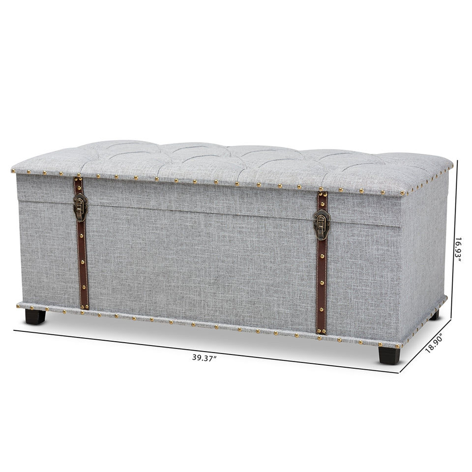 Kyra grey fabric upholstered storage trunk ottoman.