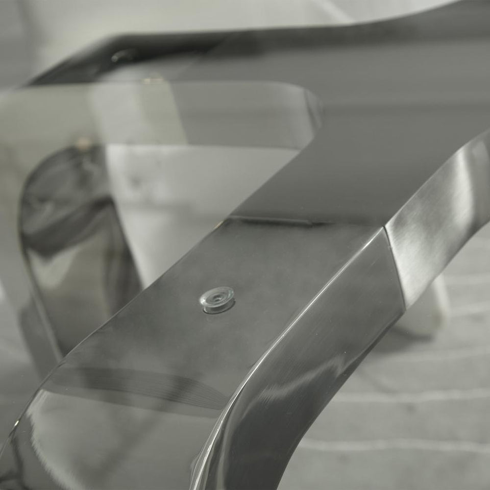 Designer Louis Lara's Cirrus table has polished base connector with brushed stainless steel and 15mm Tempered glass Top Clear