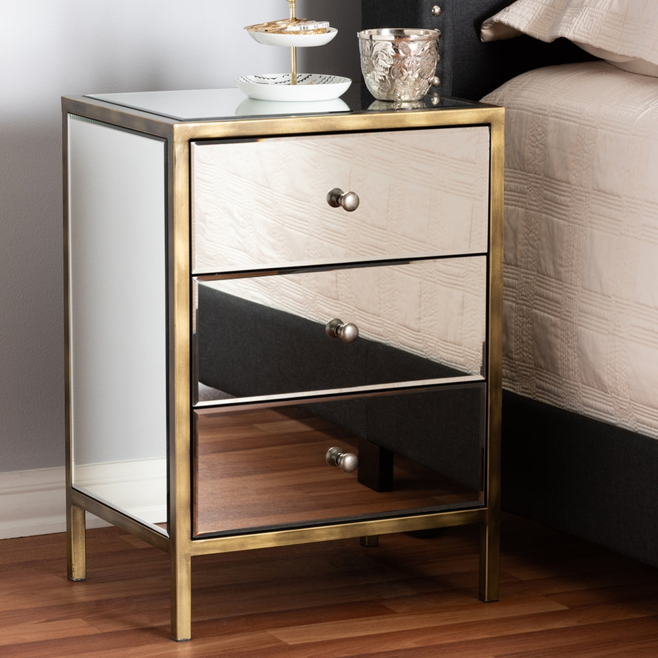 Nouria modern and contemporary hollywood regency glamour style mirrored three drawer nightstand bedside table.