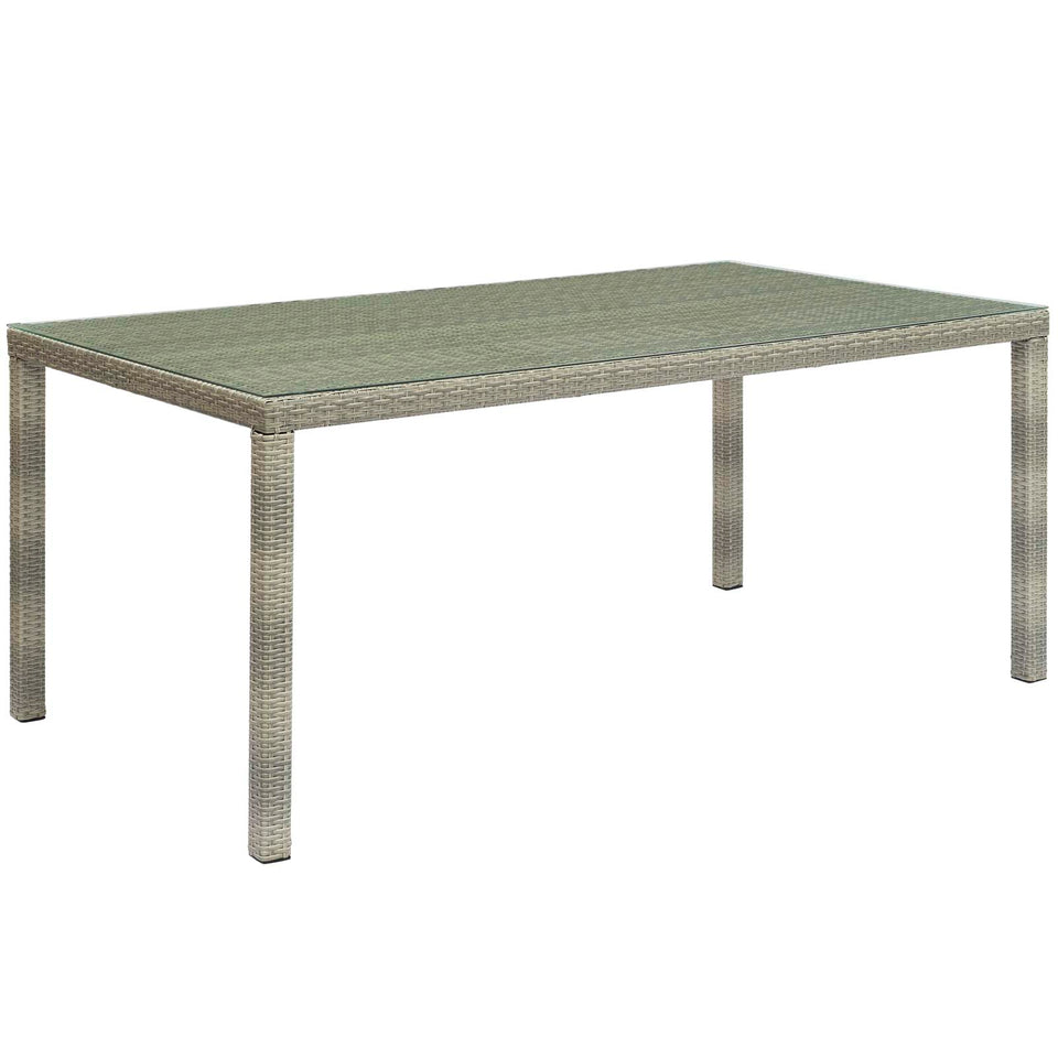 Conduit 70" Outdoor Patio Wicker Rattan Dining Table in Light Gray.