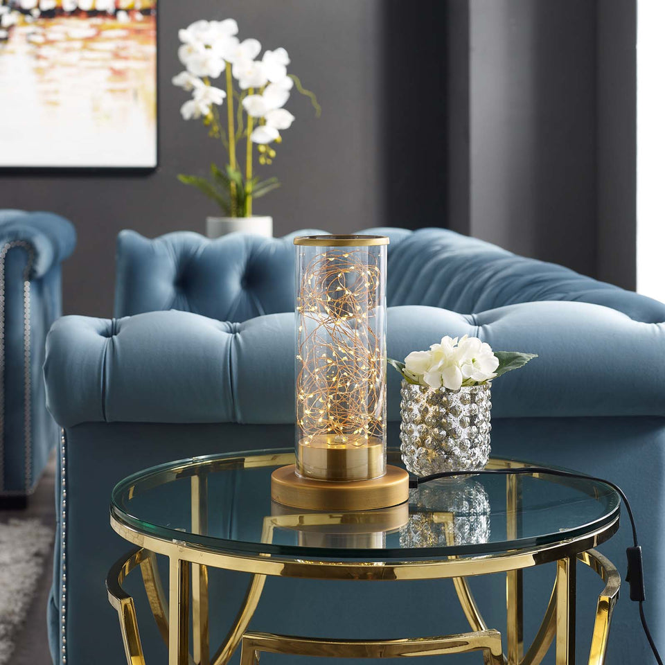 Adore Cylindrical-Shaped Clear Glass And Brass Table Lamp.