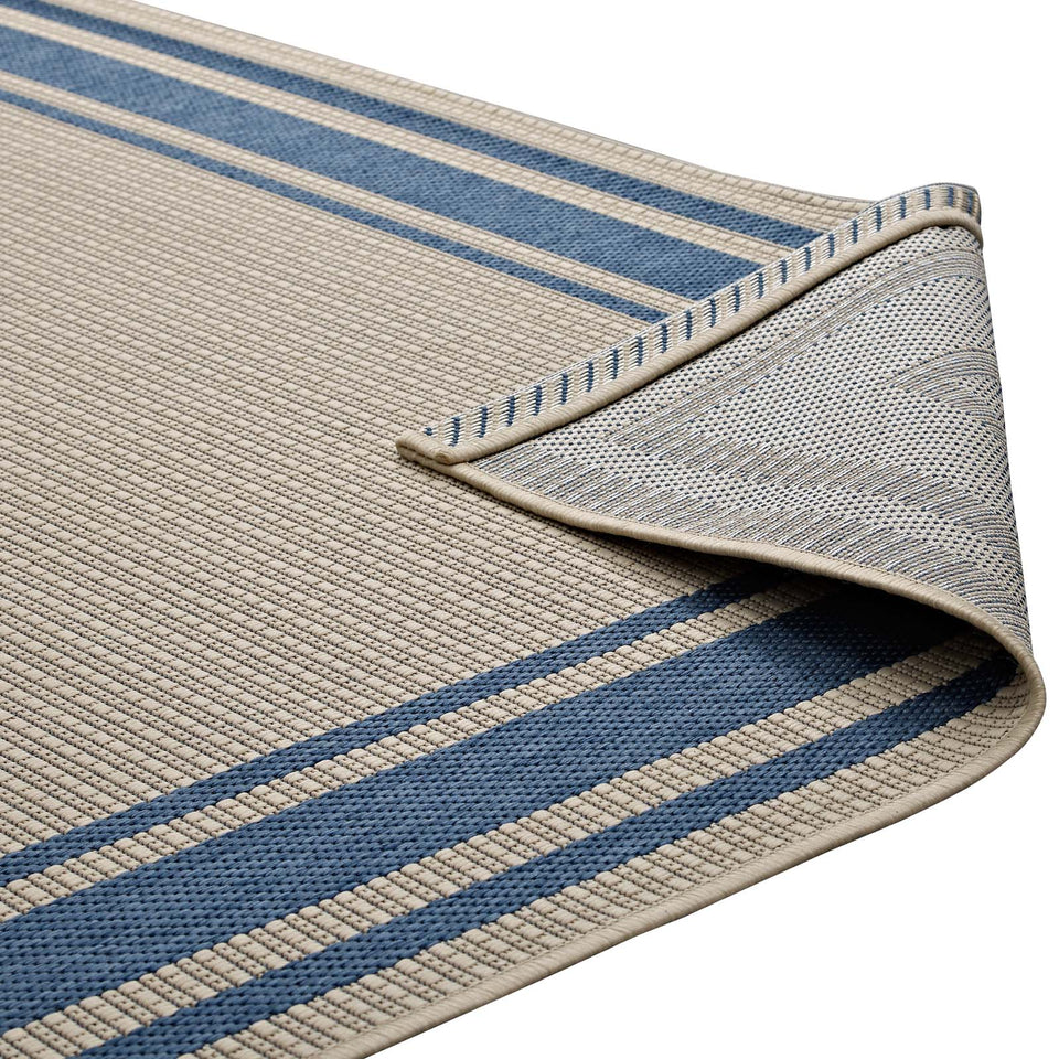 Rim Solid Border Indoor and Outdoor Area Rug in Blue and Beige.