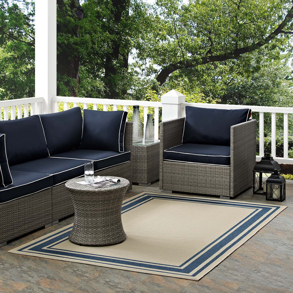 Rim Solid Border Indoor and Outdoor Area Rug in Blue and Beige.